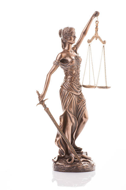 istock Statue of justice isolated on the white background 624064132