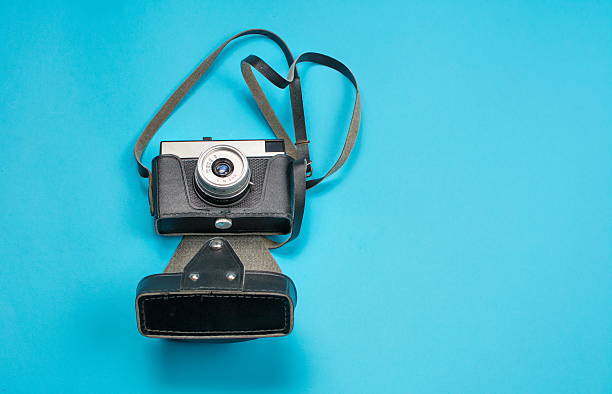 istock vintage film camera on blue background 624064442