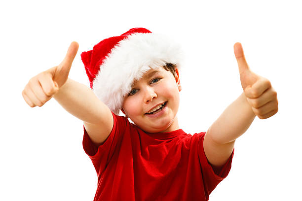 istock Christmas time - boy with Santa Clause hat 624064824