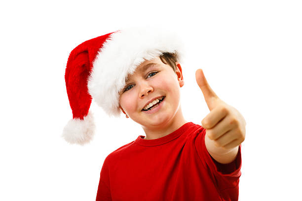 istock Christmas time - boy with Santa Clause hat 624064850