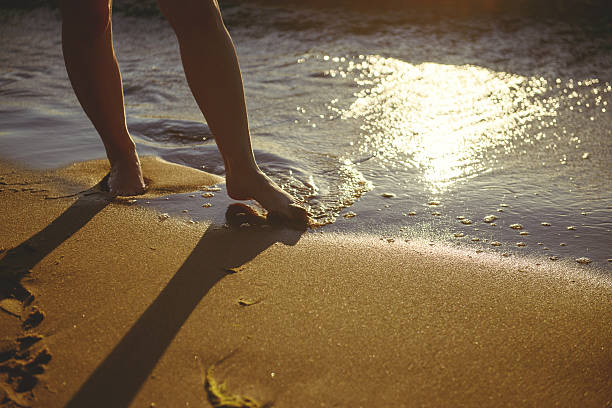 istock Feet closeup on beach 624065466