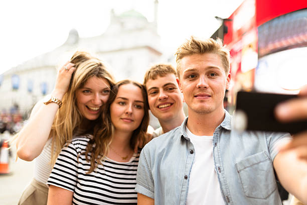 istock friends take a selfie in piccadilly circus 624097294