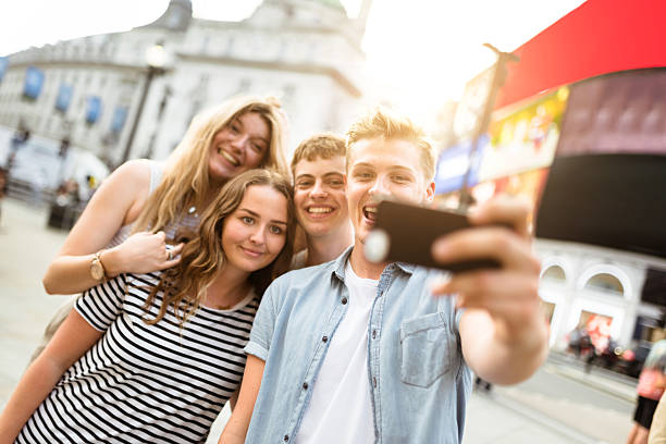istock friends take a selfie in piccadilly circus 624097404