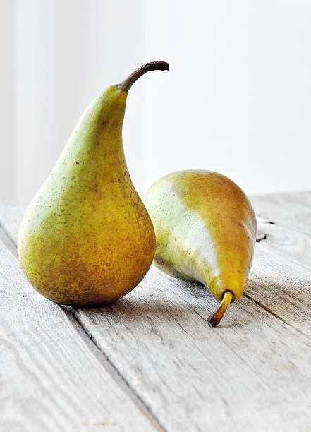 istock Pear on a wooden table. 624099920