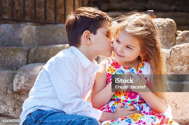 Children Show Love And Affection To Each Other Stock Photo - Download Image Now - Innocence, Kissing, Beautiful People