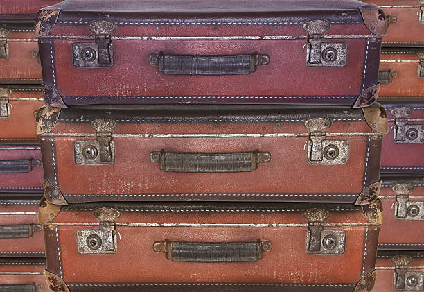 istock Evacuation - Old worn travel suitcases 624101040