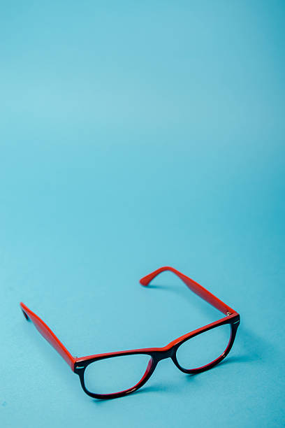 istock pair of red plastic-rimmed eyeglasses 624101162