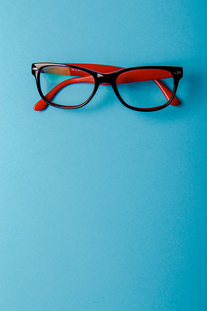 istock pair of red plastic-rimmed eyeglasses 624101304