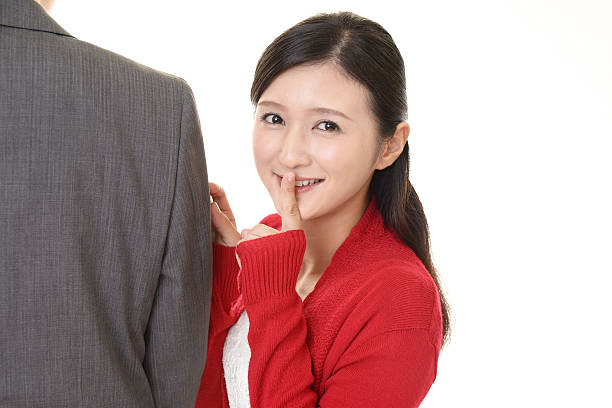 istock Woman placing finger on lips 624101608