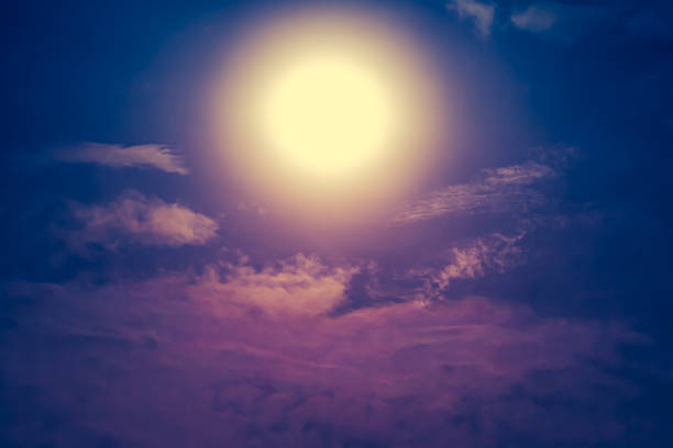 istock Nighttime sky with clouds and bright full moon with shiny. 624108846