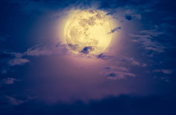 istock Nighttime sky with clouds and bright full moon. Vintage tone. 624108928