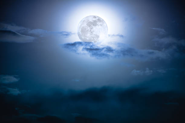 istock Nighttime sky with clouds and bright full moon with shiny. 624109170