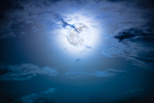 istock Nighttime sky with clouds and bright full moon with shiny. 624109482