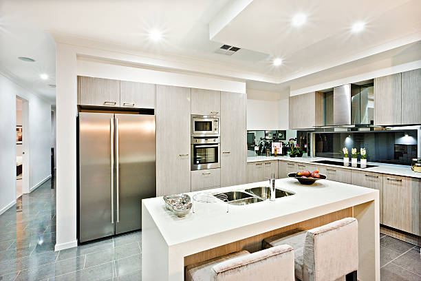 istock Modern kitchen counter top with a fridge and pantry 624110876