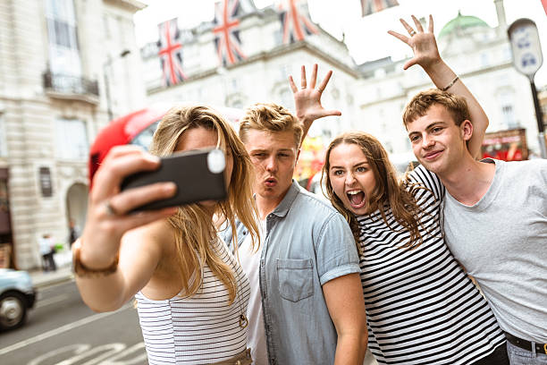 istock friends take a selfie in piccadilly circus 624111822