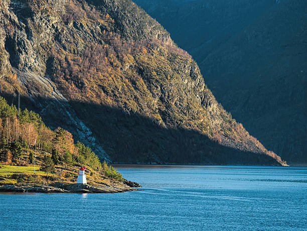 istock Majestic sognefjord with lighthouse in sunlight, Norway 624112372