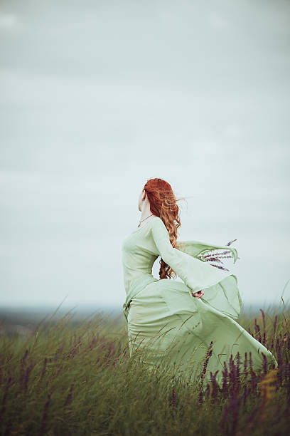 istock Young redhead girl in medieval dress 624112452