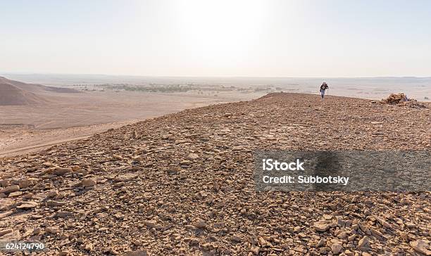 Backpacker Walking Hiking Tourist Man Desert Mountain Middle East Travel Stock Photo - Download Image Now
