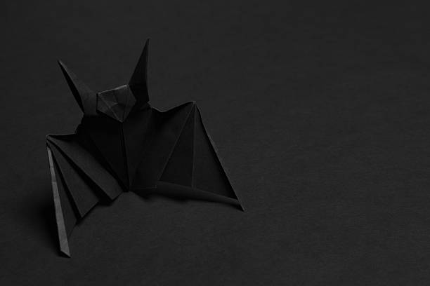 istock The mouse is hand-made from paper on dark background 624127918