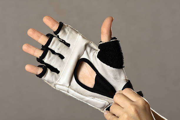 istock hands putting on glove for martial arts 624128176