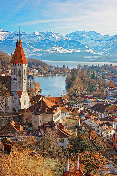Panorama of Thun Church and City with Alps and Thunersee Panorama of City Church and City of Thun with Alps and Thunersee. Thun is a city in the canton of Bern in Switzerland, where the Aare river flows out of Lake Thun. There is a view of Bernese Alps. lake thun stock pictures, royalty-free photos & images