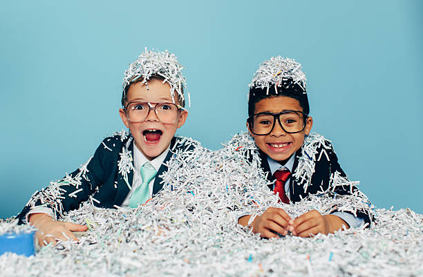 istock Two Young Businessmen Boys Covered in Shredded Paper 624130210