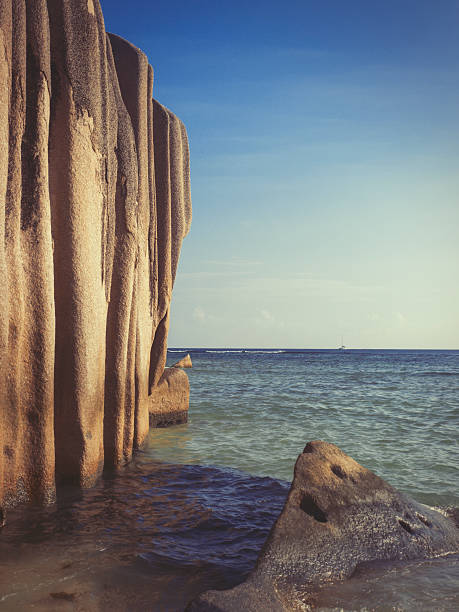Weathered by the ages, sandstone rock formations and boulders forming intriguing patterns and shapes on coast near Kudat Sabah Borneo.