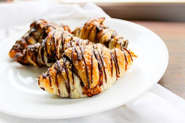 Chocolate Drizzled Croissants stock photo