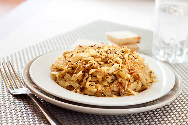 istock Fried cabbage with caraway and garlic on a plate 624138494
