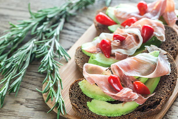 istock Sandwiches with avocado and prosciutto 624138906