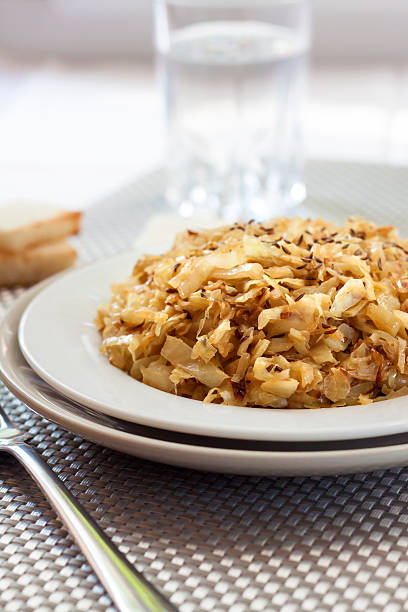 istock Fried cabbage with caraway and garlic on a plate 624139002