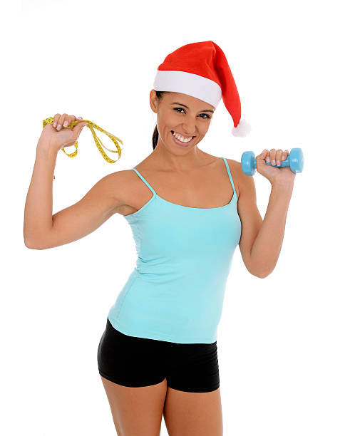 beautiful exotic hispanic woman in christmas santa hat exercise resolution - facial expression isolated lifestyles exoticism imagens e fotografias de stock