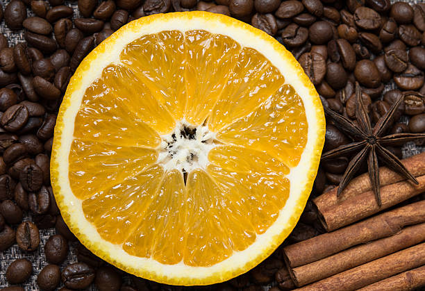 istock slice juicy orange among coffee beans 624141196