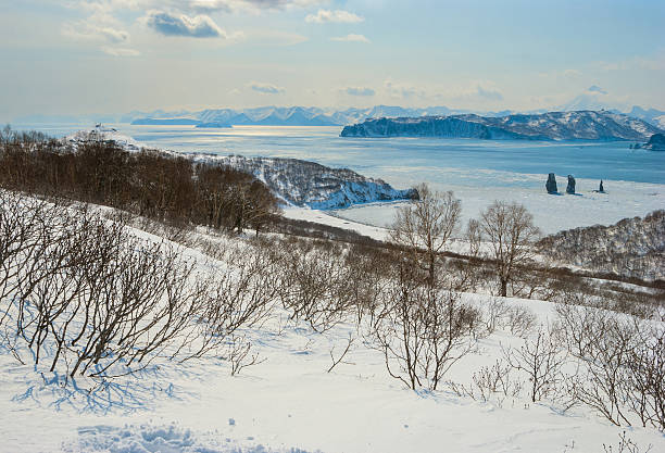 istock Three rocks in the sea among the ice 624141254