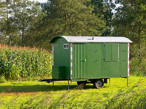 istock Workers lunch shelter amid green landscape 624153994