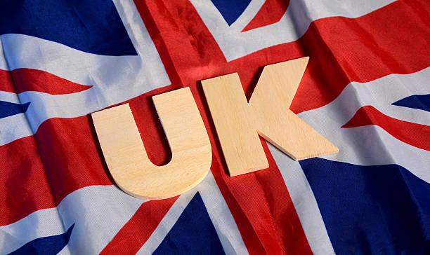 istock UK Alphabets with United Kingdom Flag in background 624155924