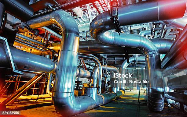 Industrial Zone Steel Pipelines And Valves Stock Photo - Download Image Now - Chemical Plant, Musical Instrument, Liquid