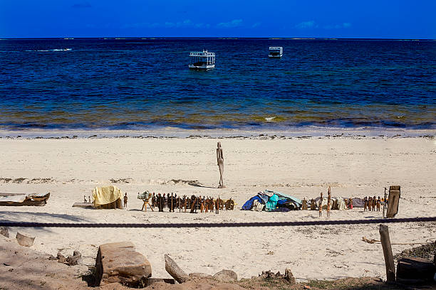 Bamburi Beach in Kenya Bamburi, Kenya- November 15, 2016: Popular touristic beach near Mombasa full of local vendors selling various Kenyan souvenirs ebb and flow stock pictures, royalty-free photos & images