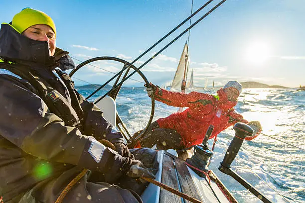 Sailing crew on sailboat during regatta on sunny autumn morning. Taken by Sony a7R II, 42 Mpix.
