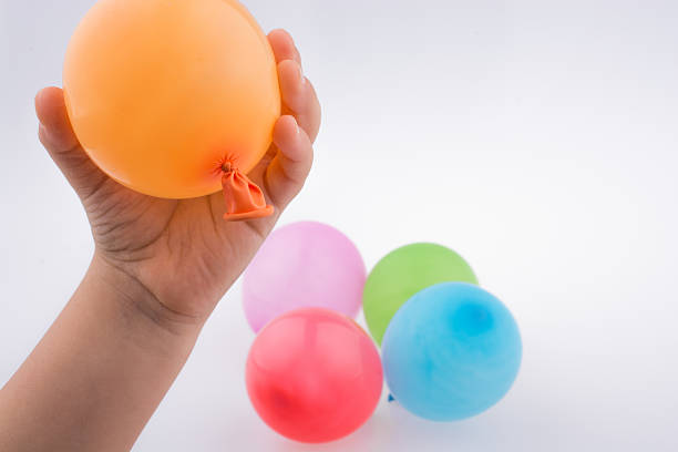 istock Hand holding a Colorful small ball oon in hand 624159966