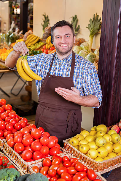 istock Man offers fresh bananas. 624160832
