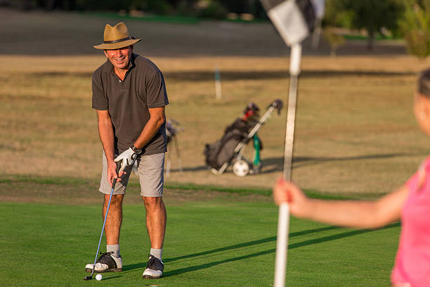 istock Happy Senior Couple Playing Golf 624161004