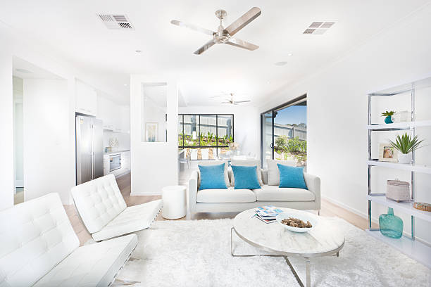 istock Modern living room with white walls illuminated  with sunlight 624161628