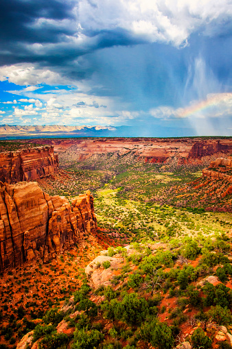 Afternoon rainstorm and rainbow in Western Colorado.