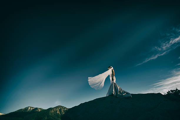 istock Portrait of a bride during a windy mountain sunset 624170810
