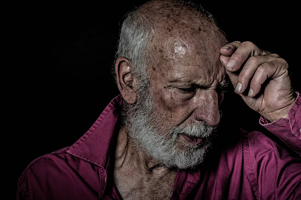 istock Senior Man Portrait, beard,  facial expression, black background 624171228