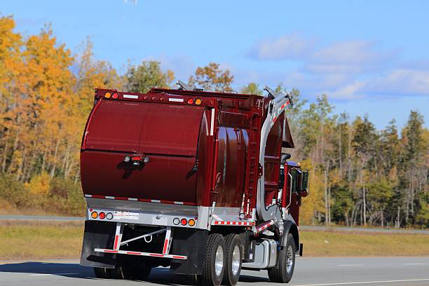istock Garbage truck on an interstate, trees in  background. 624171358