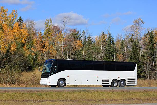 istock Charted bus on  highway. Fall colors in the background. 624171626
