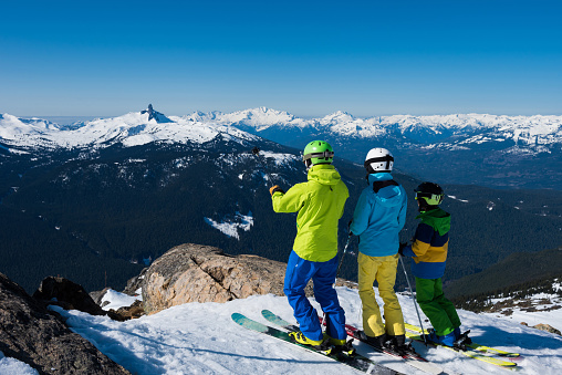 Family taking in the stunning mountain views on a ski vacation