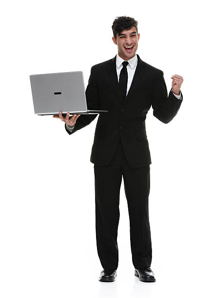 istock Cheerful businessman cheering with laptop 624181634